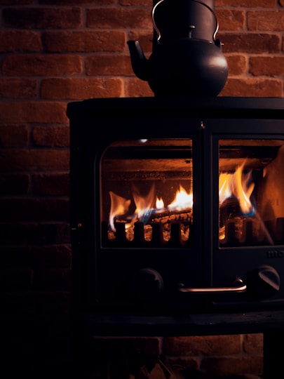 black fire place with fire