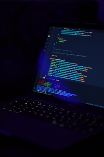 black laptop computer turned on displaying blue screen